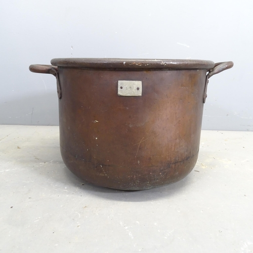 3251 - A large two handled copper bowl. 61x36x49cm.