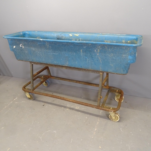 3252 - A large rectangular plastic trough on wheeled metal base. 155x87x45cm.