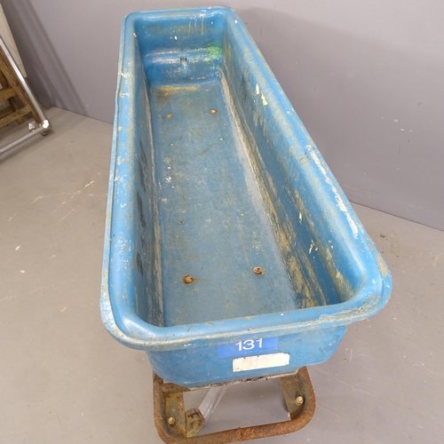 3252 - A large rectangular plastic trough on wheeled metal base. 155x87x45cm.