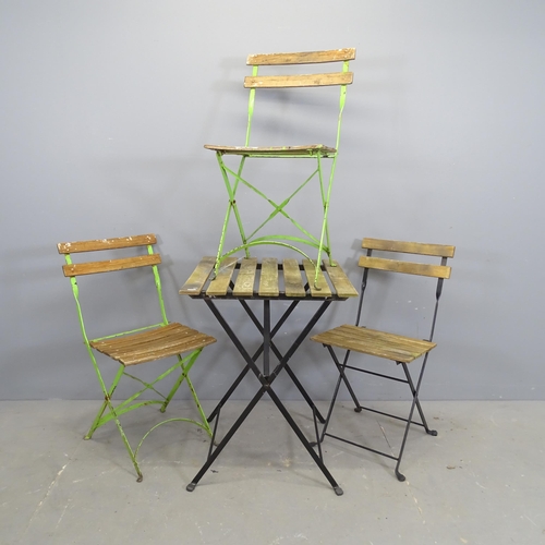 3263 - A folding bistro table with matching chair and two similar folding Parisienne folding chairs.