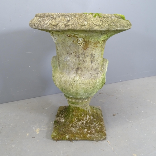 3266 - A two-section weathered concrete garden urn. 58x77cm.