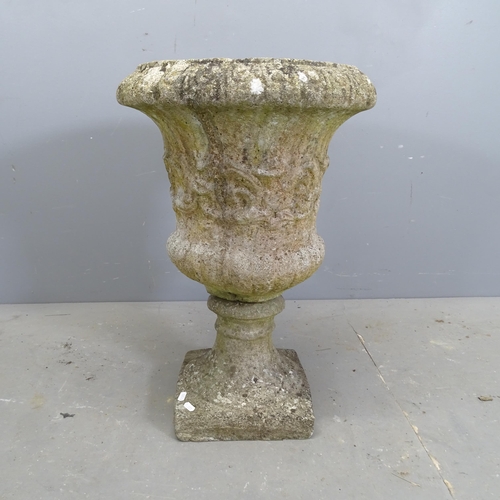 3267 - A weathered concrete two-section garden urn on stand. 43x67cm.