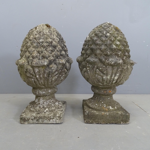 3274 - A pair of weathered concrete pineapple finials. 34x57cm.