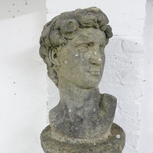 3275 - A weathered concrete bust, study of David, on associated fluted pedestal. Height overall 127cm.