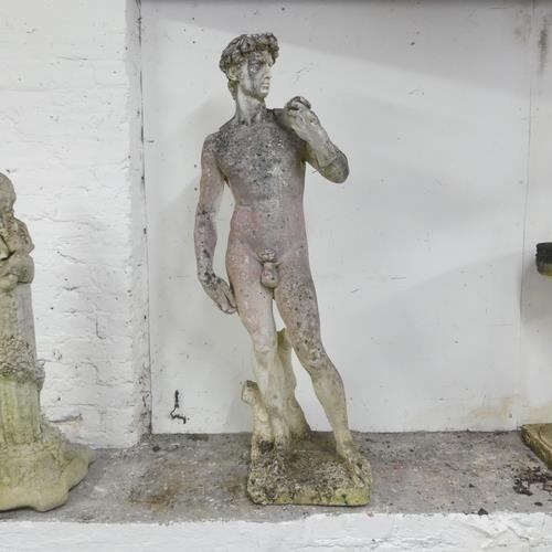 3276 - A weathered stone garden sculpture, after Michelangelo's David. Height 120cm.