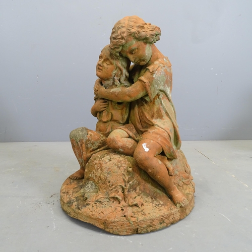 3280 - A painted concrete garden statue, two lovers embracing. Height 60cm.