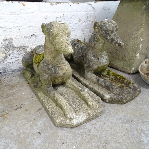 3281 - A pair of stone greyhound dog statues. 67x40x26cm.