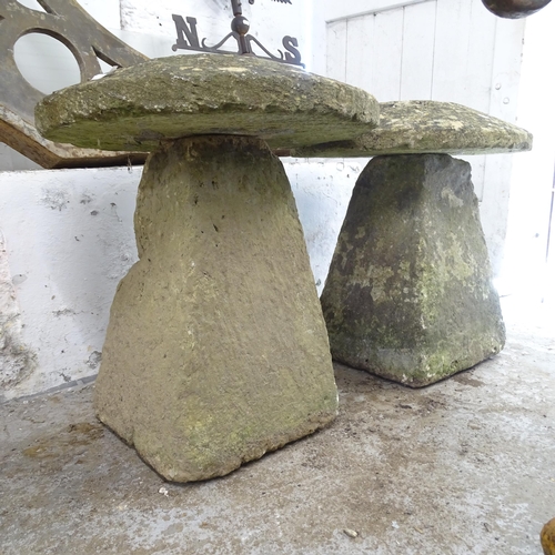 3283 - A pair of two-section weathered carved stone Staddle Stones. 56x65cm.