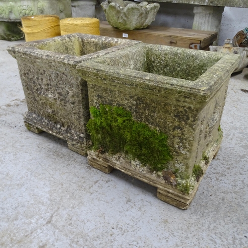 3287 - A pair of square weathered concrete planters, with moulded swag and urn decoration. 30x29x30cm.