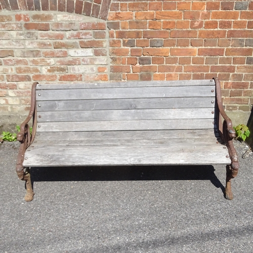 3292 - A teak slatted garden bench, with heavy Georgian cast iron ends. 158x73x80cm.