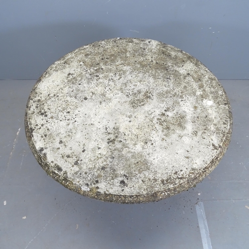 3293 - A weathered concrete circular topped garden table on Corinthian column base. 90x64cm.