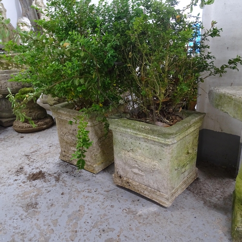 3310 - A pair of square weathered concrete garden planters. 29x31cm.