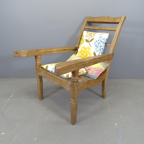 3312 - A teak plantation chair, with folding arms and perspex seat. 70x97x110cm.