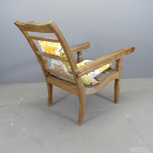 3312 - A teak plantation chair, with folding arms and perspex seat. 70x97x110cm.