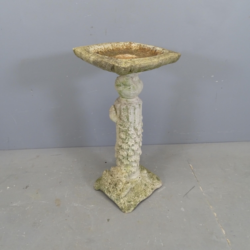 3317 - A weathered concrete two-section bird bath. 36x72cm.