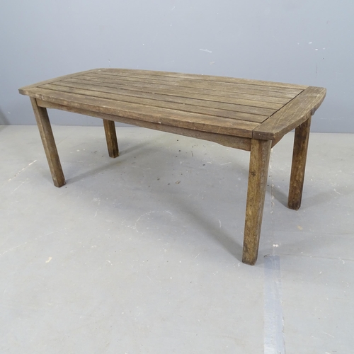 3325 - A teak slatted garden table, with label for River Han. 110x46x50cm.