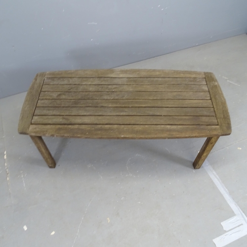 3325 - A teak slatted garden table, with label for River Han. 110x46x50cm.