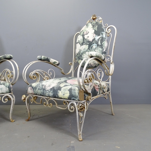 3337 - A pair of mid-century French wrought-iron conservatory lounge chairs, with scroll arms, in the manne... 