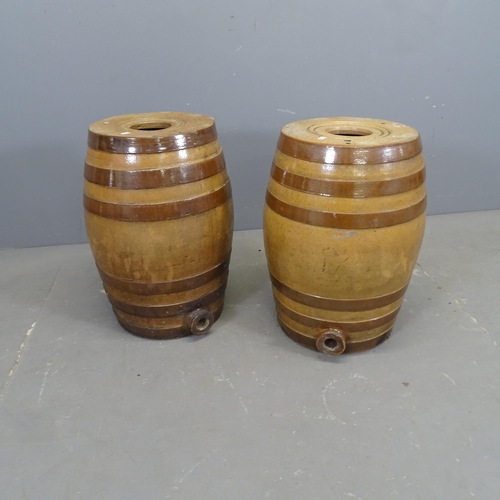 3338 - A pair of glazed stoneware barrels in the manner of Doulton Lambeth. 38x55cm.