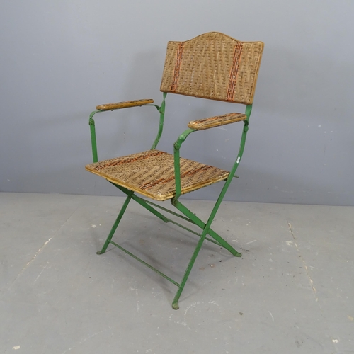 3339 - A French cane seated folding garden chair on painted metal frame.