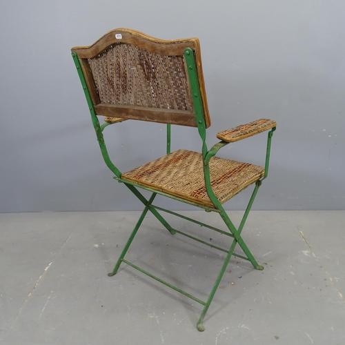 3339 - A French cane seated folding garden chair on painted metal frame.