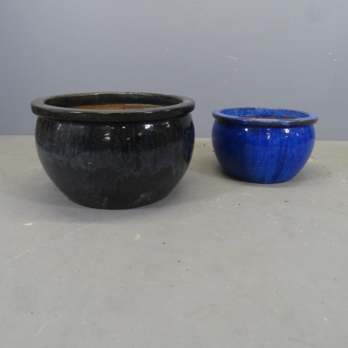 3341 - Two similar glazed terracotta plant pots. Largest 51x30cm.