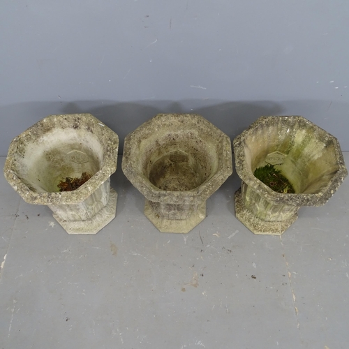 3345 - Three matching octagonal concrete garden urns , impressed HGC. 40x46cm.