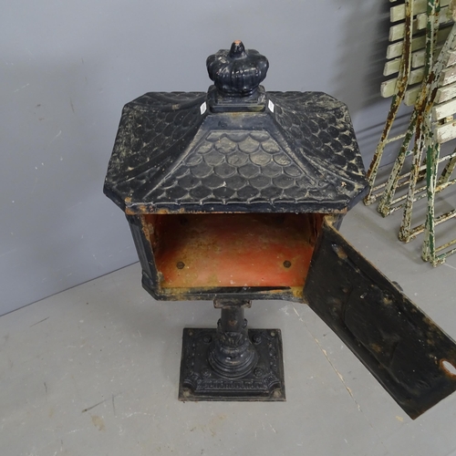 3368 - A painted cast iron letterbox. 42x113x29cm. Lacking lock.