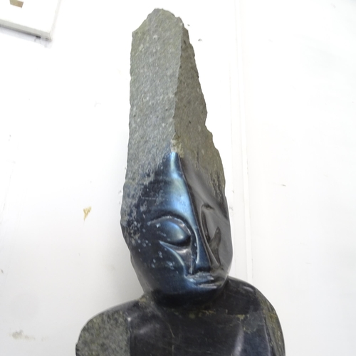 3379 - A hand carved Spring stone sculpture of a tribal chief. Height 114cm.