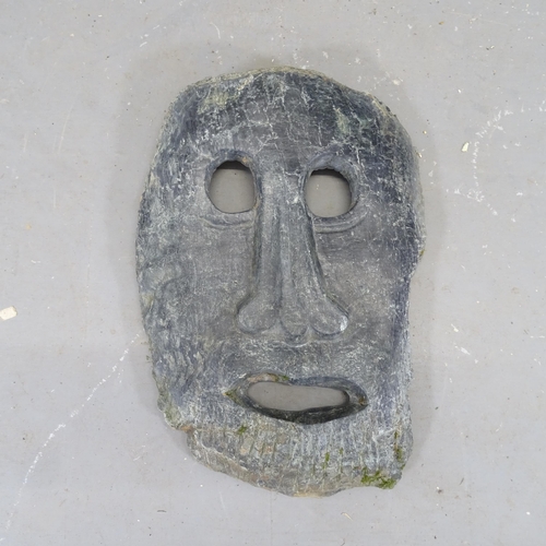 3380 - A hand carved hardstone face sculpture. Height 46cm.