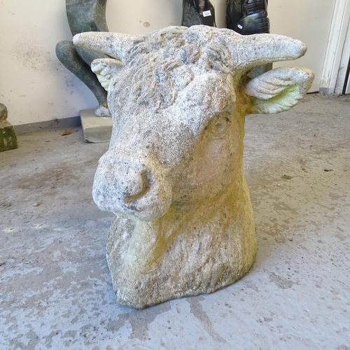 3382 - A large stone bulls head gatepost topper. 50x46x38cm