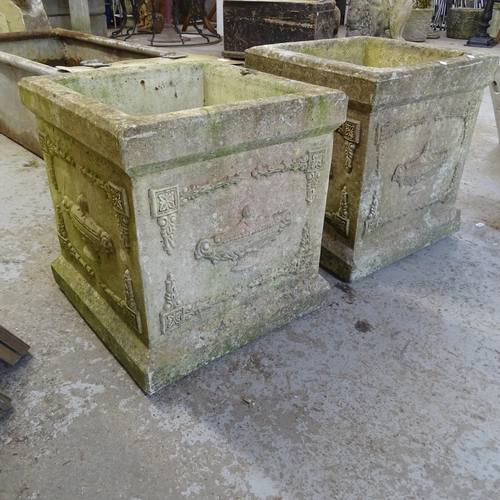 3385 - A pair of square stone planters, with swag and urn decoration. 38x43cm.