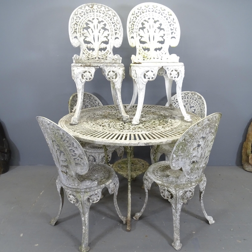 3392 - A painted metal circular garden table, and a set of six garden chairs. 107x71cm.