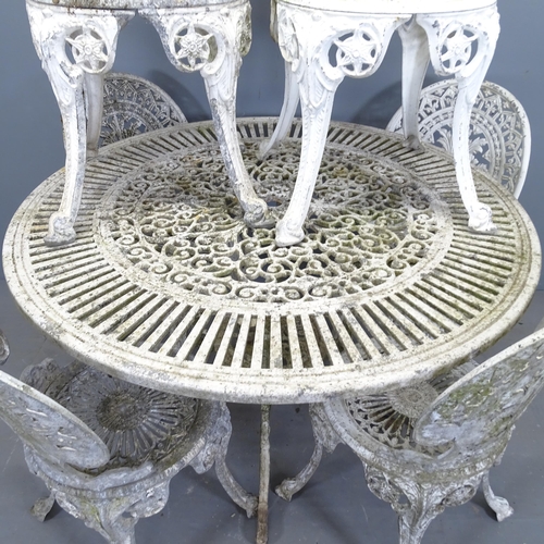 3392 - A painted metal circular garden table, and a set of six garden chairs. 107x71cm.