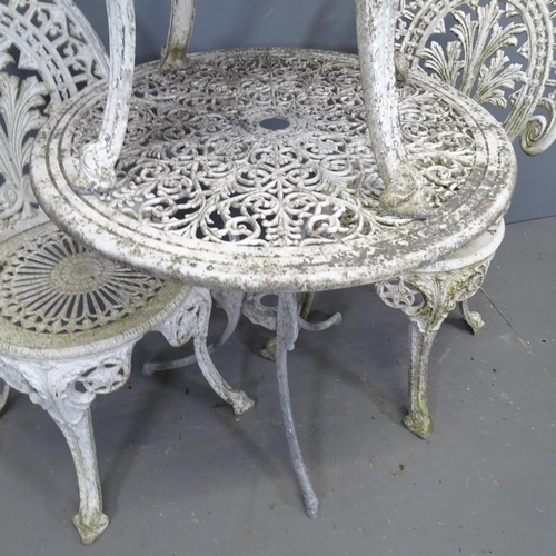 3393 - A painted metal circular garden table, 69x64cm, and three similar chairs.