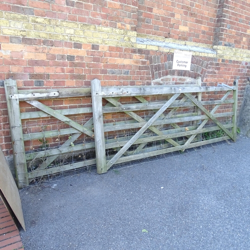 3394 - A pair of weathered wooden garden gates. Label for A.J. Charlton & Sons Ltd. of Somerset.. Each 304x... 