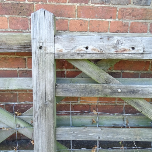 3394 - A pair of weathered wooden garden gates. Label for A.J. Charlton & Sons Ltd. of Somerset.. Each 304x... 