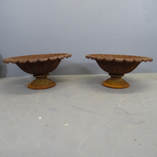 3395 - A pair of antique French two-section cast iron tazza urns on stands. 59x28cm.