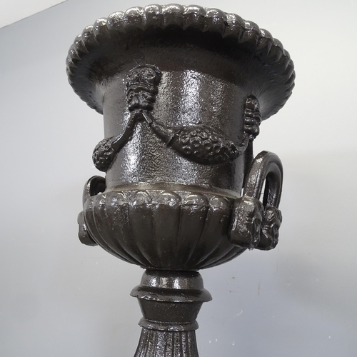 3397 - A 19th century painted two-section cast iron Medici style urn. 45x116cm.