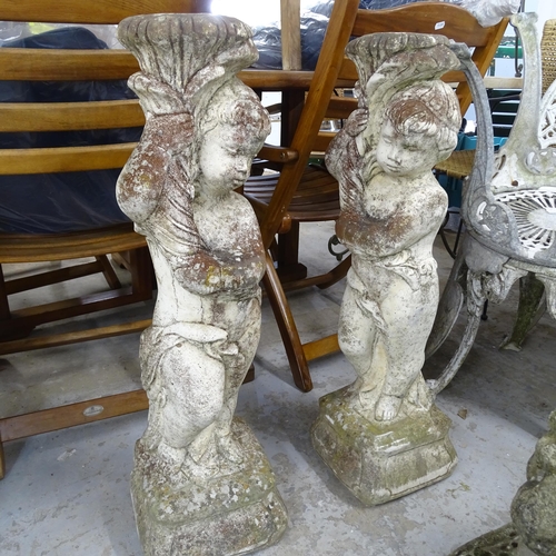 3400 - A pair of stone cherub garden statues. Height 79cm.