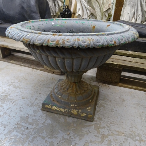 3402 - An antique painted cast iron garden urn. A/F. 53x37cm.