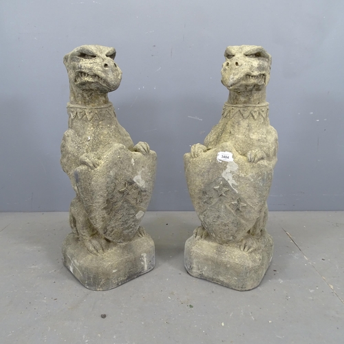 3404 - A pair of weathered stone heraldric garden statues, study of Griffin with shield. Height 73cm.