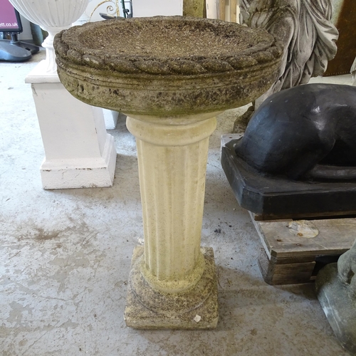 3405 - A weathered concrete two-section concrete birdbath. 41x77cm.