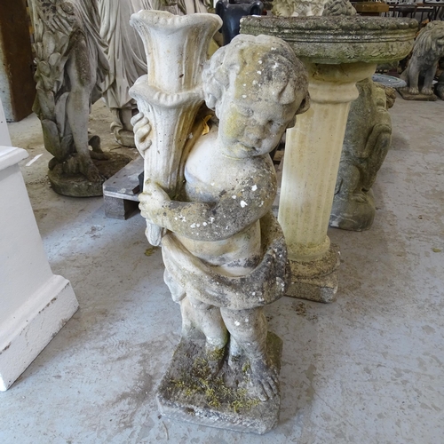 3406 - A weathered concrete garden statue, study of a cherub holding a cornucopia. Height 79cm.