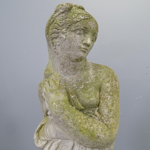 3407 - A weathered concrete garden statue, study of a lady. Height 81cm.