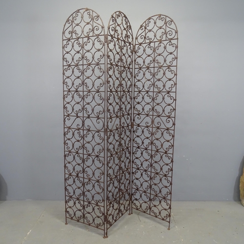 3414 - A wrought iron three-fold screen. Each panel 40x174cm.