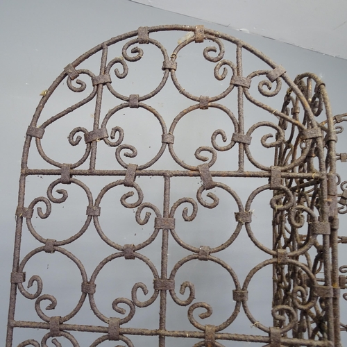 3414 - A wrought iron three-fold screen. Each panel 40x174cm.