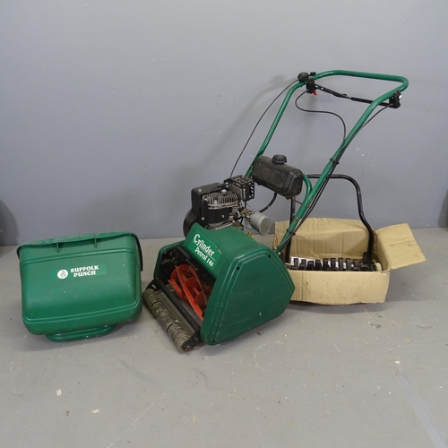 3415 - A Suffolk Punch 14s cylinder petrol mower, with scarifier attachment.