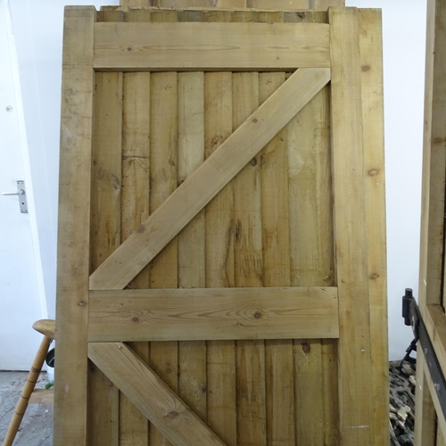 3416 - Five weathered pine garden fence panels with matching gate, and a panelled door. (7 pieces total).