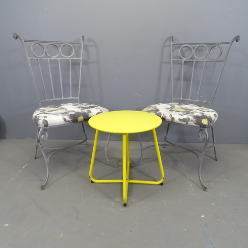 3419 - A pair of painted wrought metal and upholstered garden chairs, with a painted low table on tubular m... 